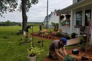 Outdoor lighting installation in progress on a residential property in Kentucky and Ohio