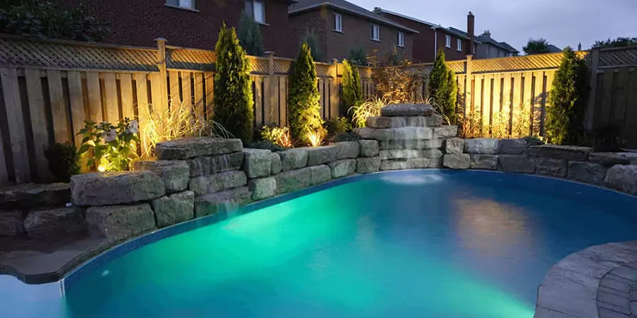 A beautiful pool landscaping around the fence
