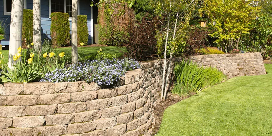 Retaining walls with green garden in Hackberry